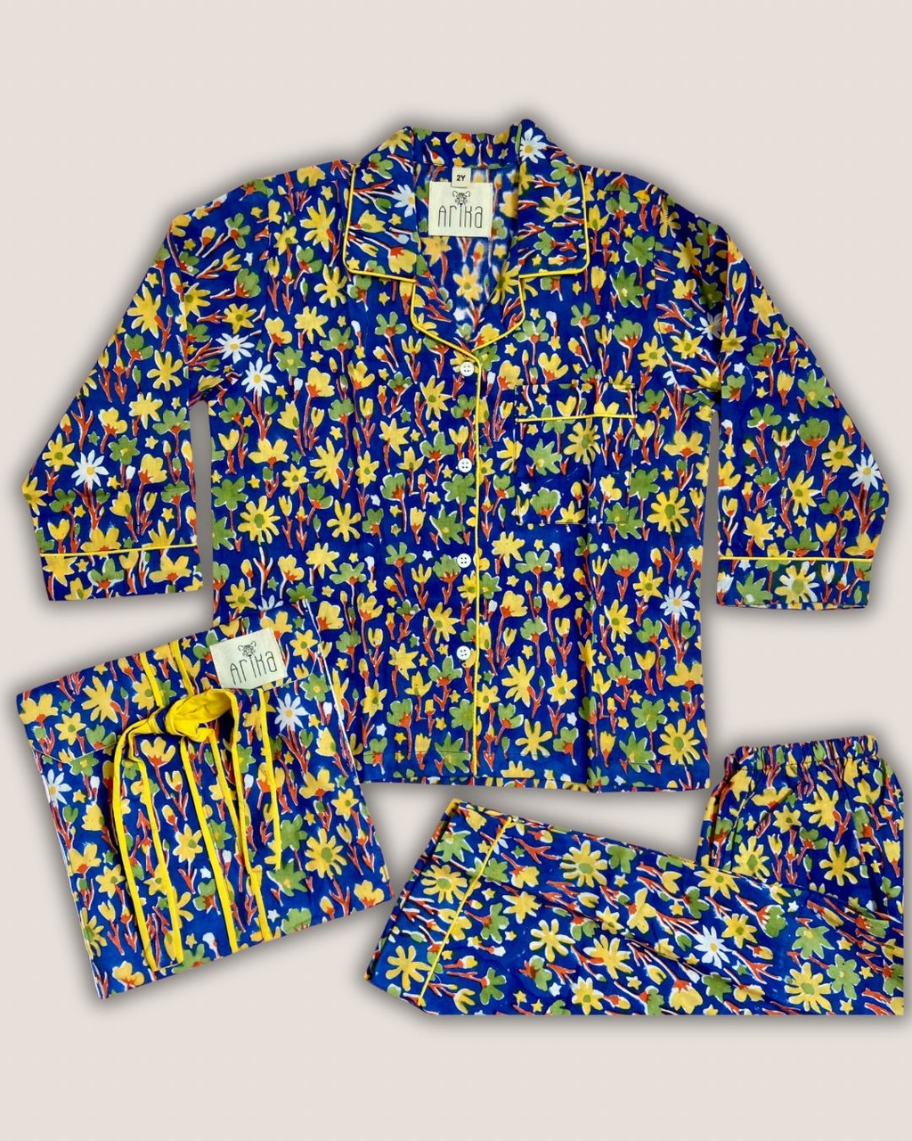 566-0198af3d-6465-7758-822d-3cc211d9097b.jpg Pijama 2T - Flores Amarillas - Imagen 1